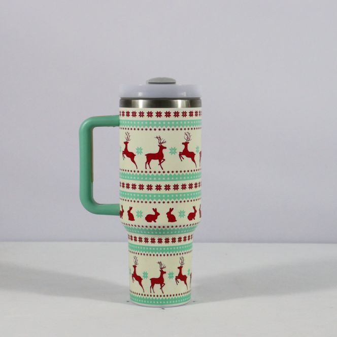 Travel mug with reindeer pattern on a white background