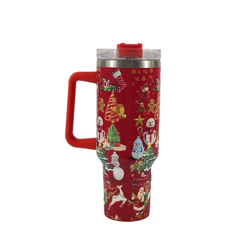 Red tumbler with Christmas-themed design on a white background
