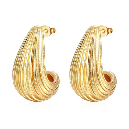 Pair of elegant gold-tone textured hoop earrings with a curved ribbed design