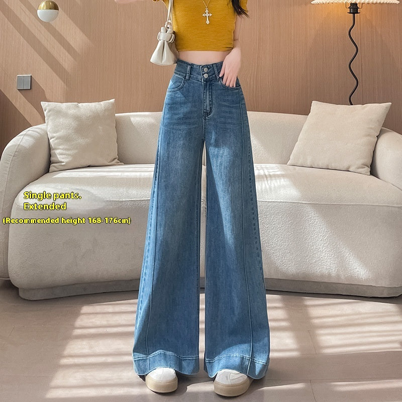 Woman wearing high-waisted wide-leg blue jeans and yellow cropped top in modern living room