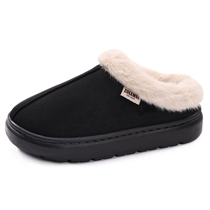 Black slipper with beige fur lining on a white background