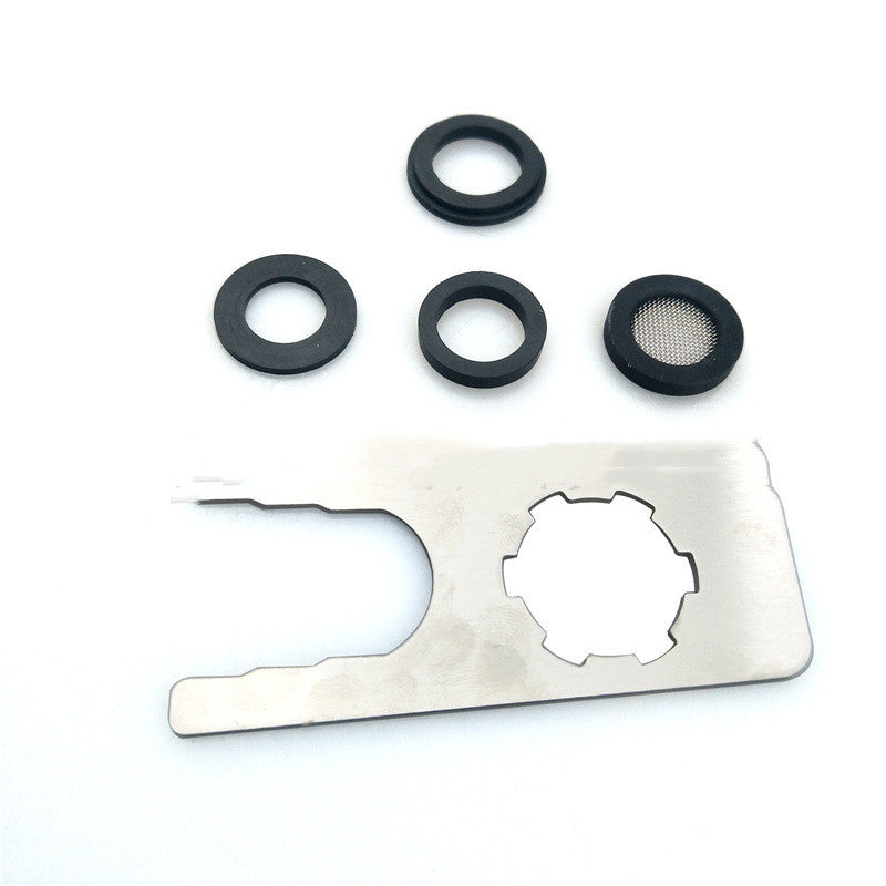 Set of black rubber washers and a metal multi-tool with cutouts on white background
