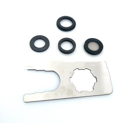 Set of black rubber washers and a metal multi-tool with cutouts on white background
