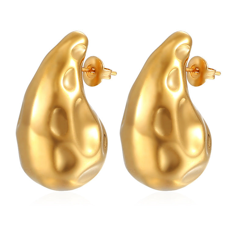 Pair of shiny gold abstract irregular shape stud earrings with post backings