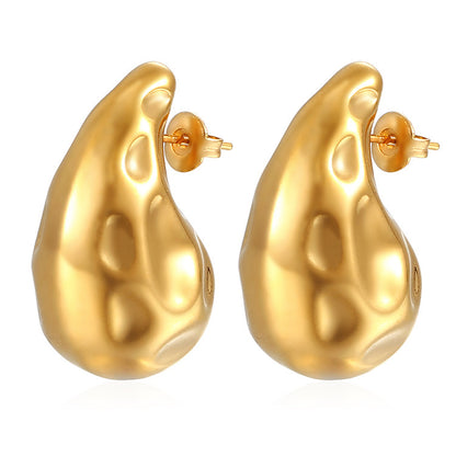 Pair of shiny gold abstract irregular shape stud earrings with post backings