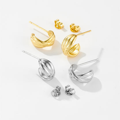 Gold and silver twisted hoop stud earrings with matching butterfly backs on white background