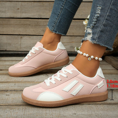Pink and white casual sneakers with white laces worn with distressed blue jeans and a pearl anklet