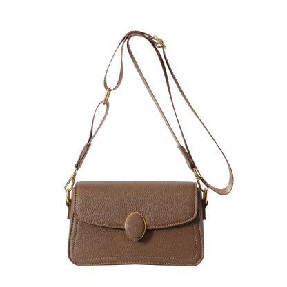 Brown textured leather crossbody bag with adjustable strap and gold oval clasp
