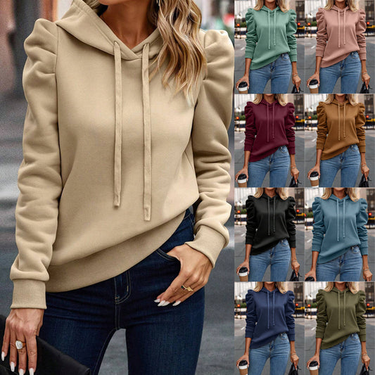 Women wearing puff sleeve hoodies in various colors paired with jeans, casual street style fashion